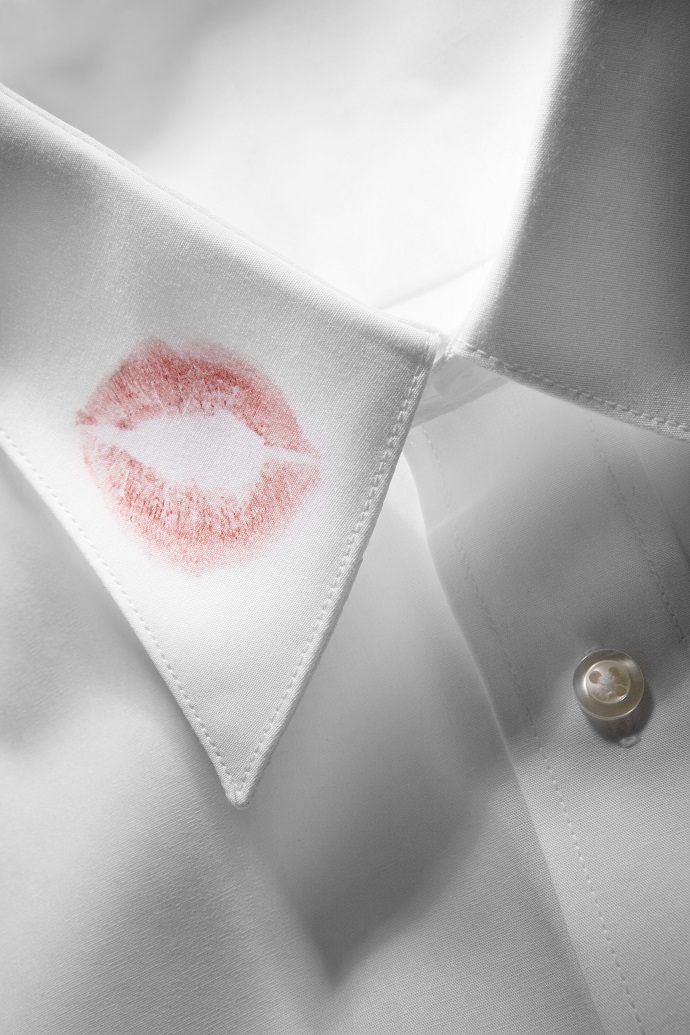 Detail of lipstick on man's collar