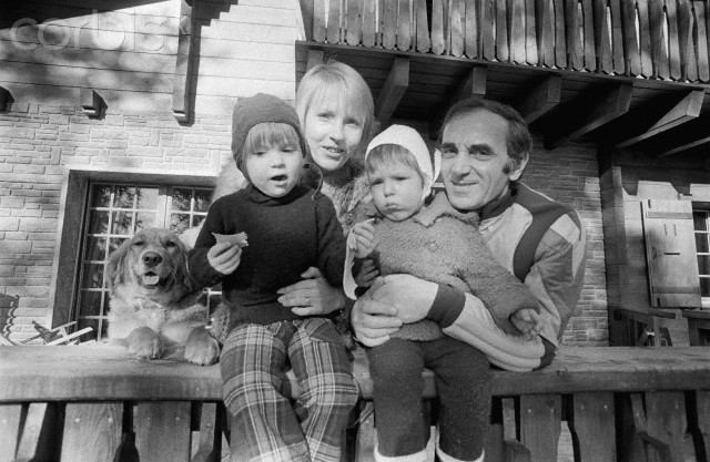 13 Jan 1973, Crans-Montana, Switzerland --- French singer and composer Charles Aznavour and his wife Ulla with their daughter Katia (27 months), and son Misha (13 months) on the terrace of their chalet L'Ou-Rou-Ka. --- Image by © James Andanson/Sygma/Corbis