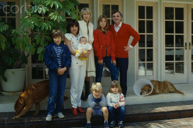 1983, Los Angeles, California, USA --- French singer, songwriter and actor of Armenian origin Charles Aznavour and his third wife Swede Ulla Thorsell. (L to R) Their son Misha, his daughter Seda (he had with first wife Micheline) with grandson, their daughter Katia, their son Nicolas and the other child of Seda. --- Image by © Albane Navizet/Kipa/Corbis