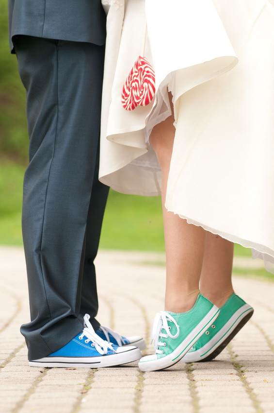 Briede and groom's legs in color gym shoes