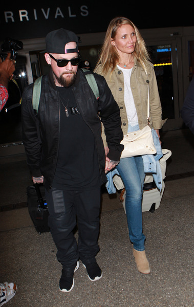 Cameron Diaz and Benji madden arriving on a flight at LAX airport ,in Los Angeles, CA